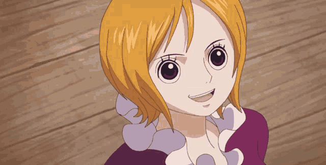 a cartoon girl with blonde hair and blue eyes smiles
