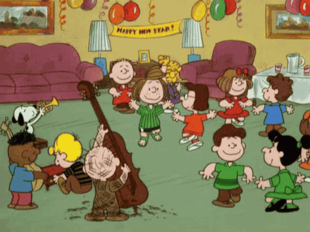 a group of peanuts characters are dancing in a living room with a banner that says happy new year
