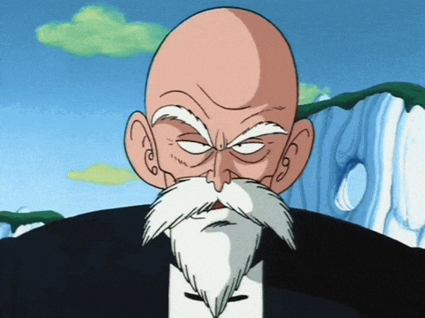 a bald man with a white beard and mustache is wearing a black suit