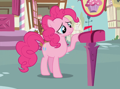 a pink pony is standing next to a pink mailbox