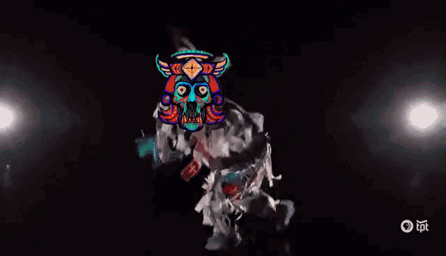 a person with a skull on their head is dancing