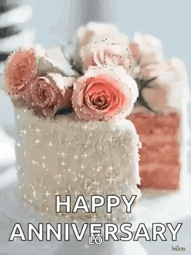 a happy anniversary cake with pink roses on top of it .