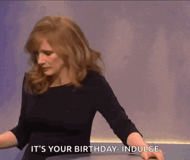 a woman in a black dress is saying it 's your birthday indulge .