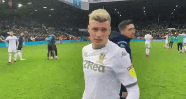 a soccer player wearing a jersey that says 2reat on it