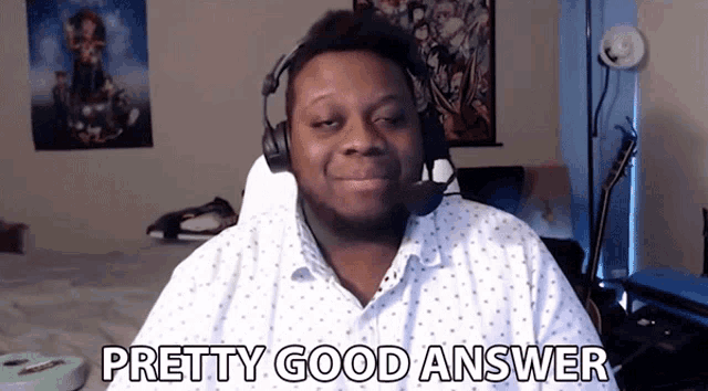 a man wearing headphones and a white shirt says " pretty good answer "