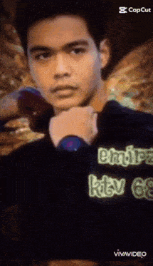 a man wearing a black shirt that says emirz ktv 68 on it