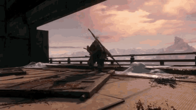 a person standing on a ledge with a sword in front of a mountain