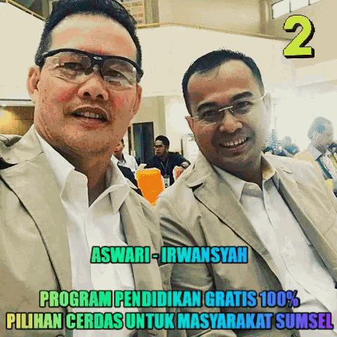 two men are posing for a picture and the caption says aswari-irwansyah