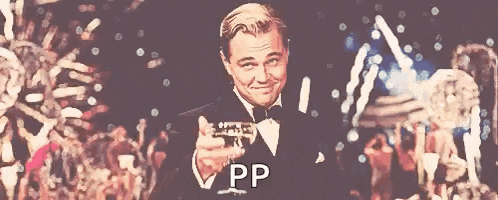 a man in a tuxedo is holding a glass of champagne and the word pp is on the bottom