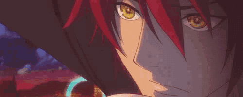 a close up of a person with red hair and yellow eyes looking at the camera .