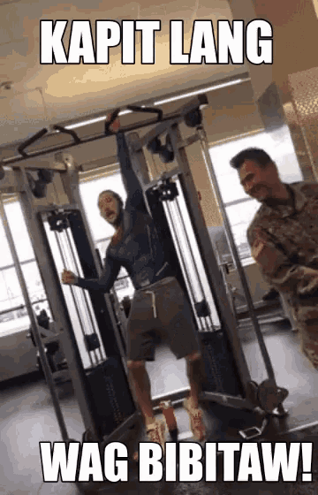 a man is doing pull ups in a gym with the caption kapit lang wag bibitaw !