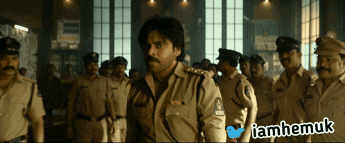 a group of police officers are standing in a room with a twitter icon above them that says " iamhemuk "