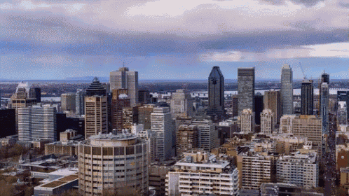 an aerial view of a city skyline with a large building in the middle