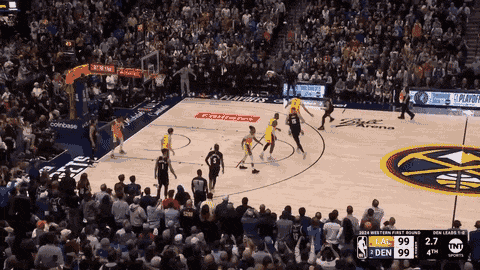 a basketball game is being played in front of a crowd sponsored by coinbase and tnt sports