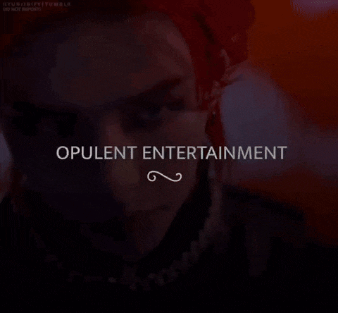 a close up of a man 's face with the words opulent entertainment written above him .