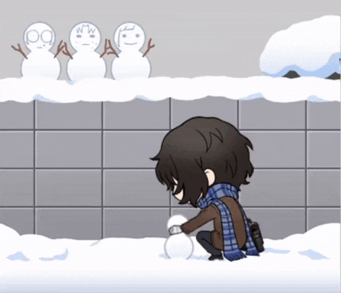 a boy is making a snowman in front of a wall with snowmen on it