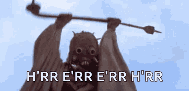 a person in a gas mask is holding a stick over their head and saying h 'rr e 'rr