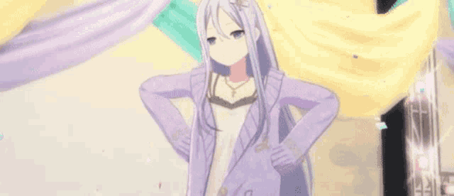 a girl with long white hair is standing on a stage with her hands behind her back .