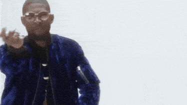 a close up of a man wearing glasses and a jacket