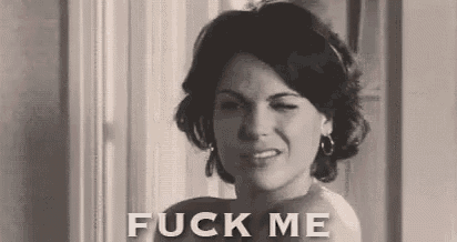 a black and white photo of a woman with the words `` fuck me '' written on her face .