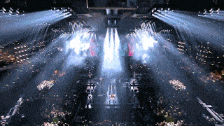 a stage with a lot of lights on it and a person on it