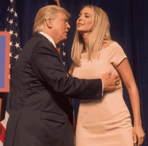 a man in a suit and a woman in a pink dress are standing next to each other