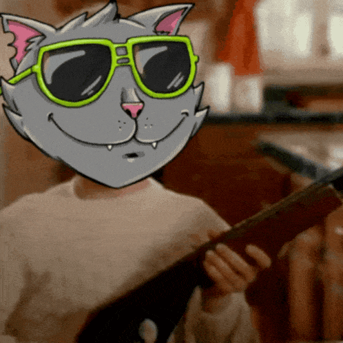 a cartoon cat wearing green sunglasses is holding a book