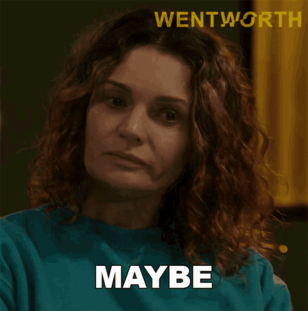 a woman with curly hair says " maybe " in front of a picture of wentworth
