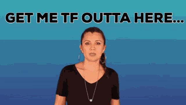 a woman says get me tf outta here while standing in front of a blue background