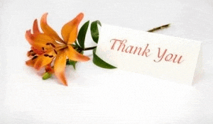 a thank you card with a flower in the background .