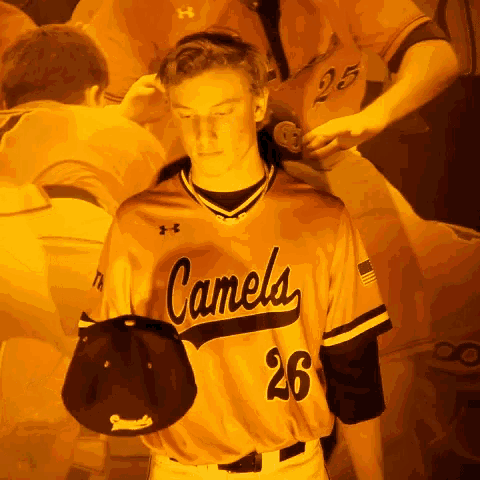 a baseball player wearing a jersey that says camels 26