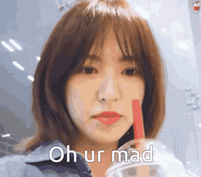 a girl with a red straw in her mouth says " oh ur mad "