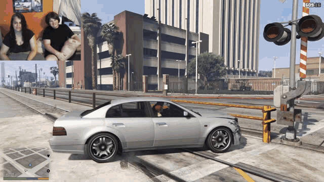 a video game screen shows a car on the tracks