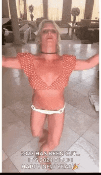 a woman in a bikini is dancing with her arms outstretched .