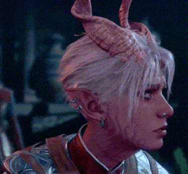 a close up of a person with horns on their head and a nose ring .
