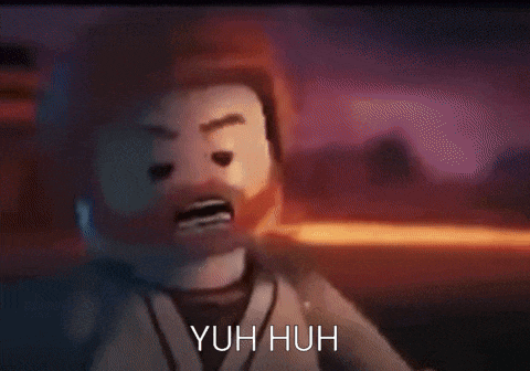 a close up of a lego man 's face with the words ` ` nuh uh ` ` written below it .