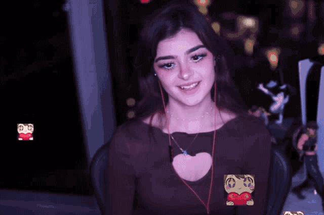 a woman wearing ear buds and a heart shaped shirt