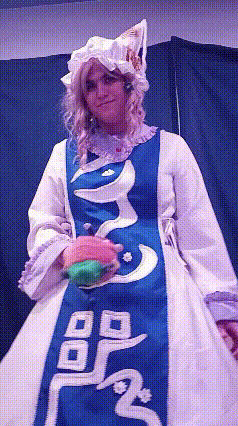 a woman in a blue and white dress with chinese writing