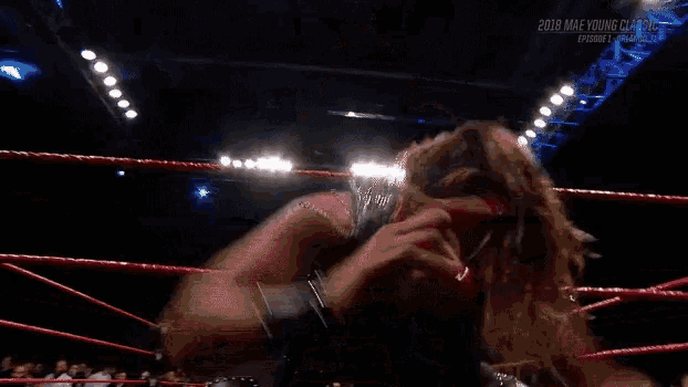 a wrestler in a wrestling ring with the year 2018 on the bottom