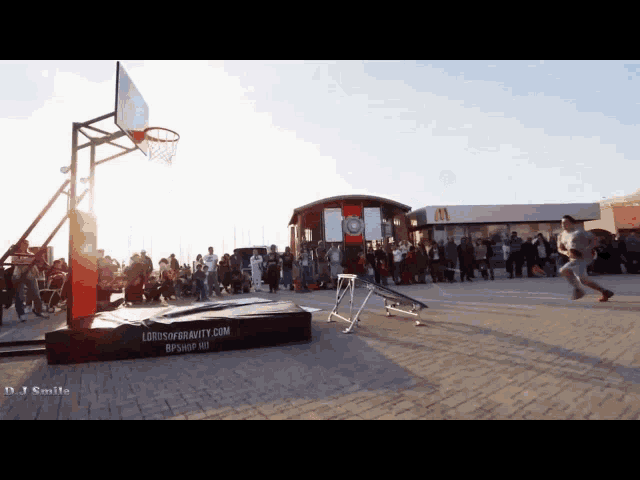 a basketball hoop with the website lordsofgravity.com on the side