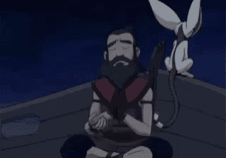 a man with a beard is sitting in a lotus position on a roof with a cat .