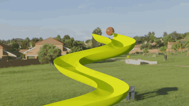 a park with a yellow slide and a picnic table in the foreground