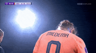 a soccer player with the name miedema on his back