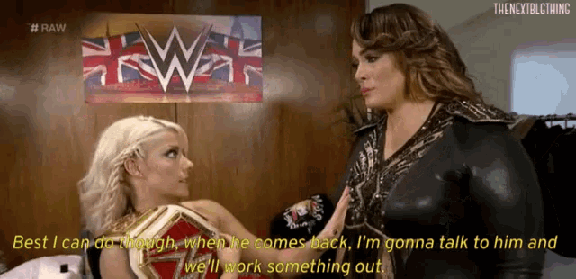 two women are talking to each other in front of a sign that says raw
