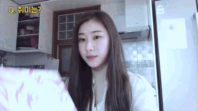 a woman in a kitchen with a question in korean