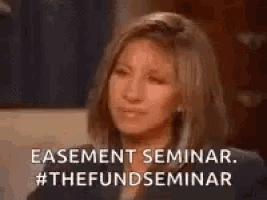 barbra streisand is smiling and talking about a seminar .