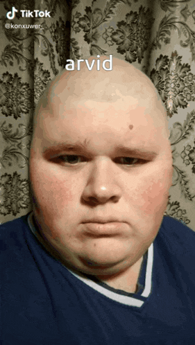 a man with a bald head has the word arvid written on the bottom of his face