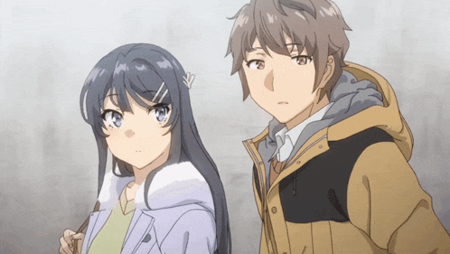 a boy and a girl are standing next to each other and looking at something
