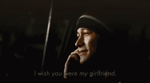 a man talking on a cell phone with the words i wish you were my girlfriend