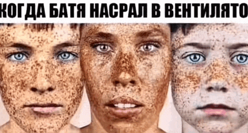 a woman and two children with freckles on their faces are standing next to each other .